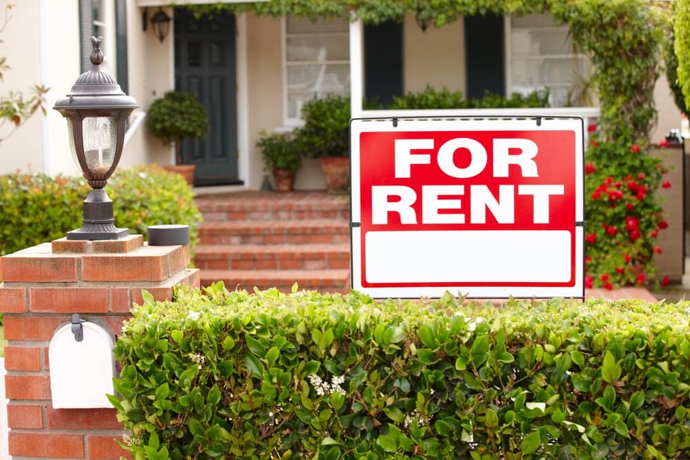 For Rent sign posted outside a residential home