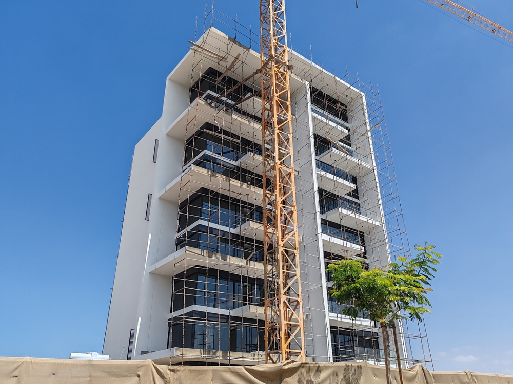 Exterior view of a high-rise residential building under construction